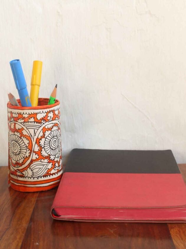 Orange-white-Tholu-bommalata-pen-holder