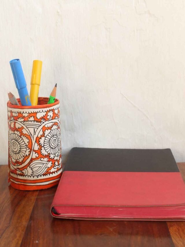 Orange-white-Tholu-bommalata-pen-holder