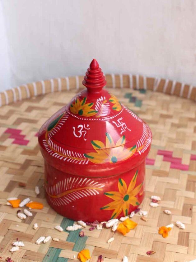 Yellow-flowers-on-red-wooden-sindur-dani