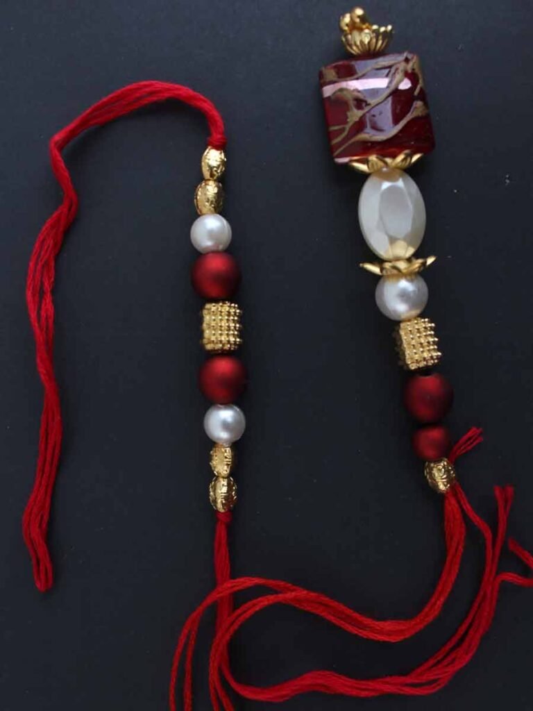 Red and White Bhaiya-Bhabhi Rakhi Pair – Shilphaat.com