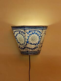 Blue--and-white-tholu-bommalata-wall-lamp