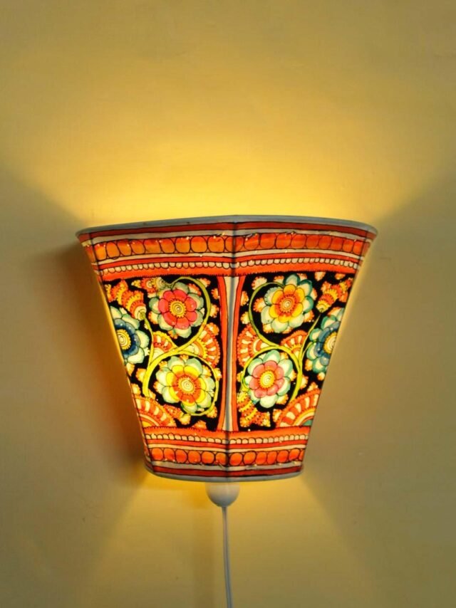 Floral-Black-Tholu-Bommalata-leather-wall-lamp at Shilphaat.com