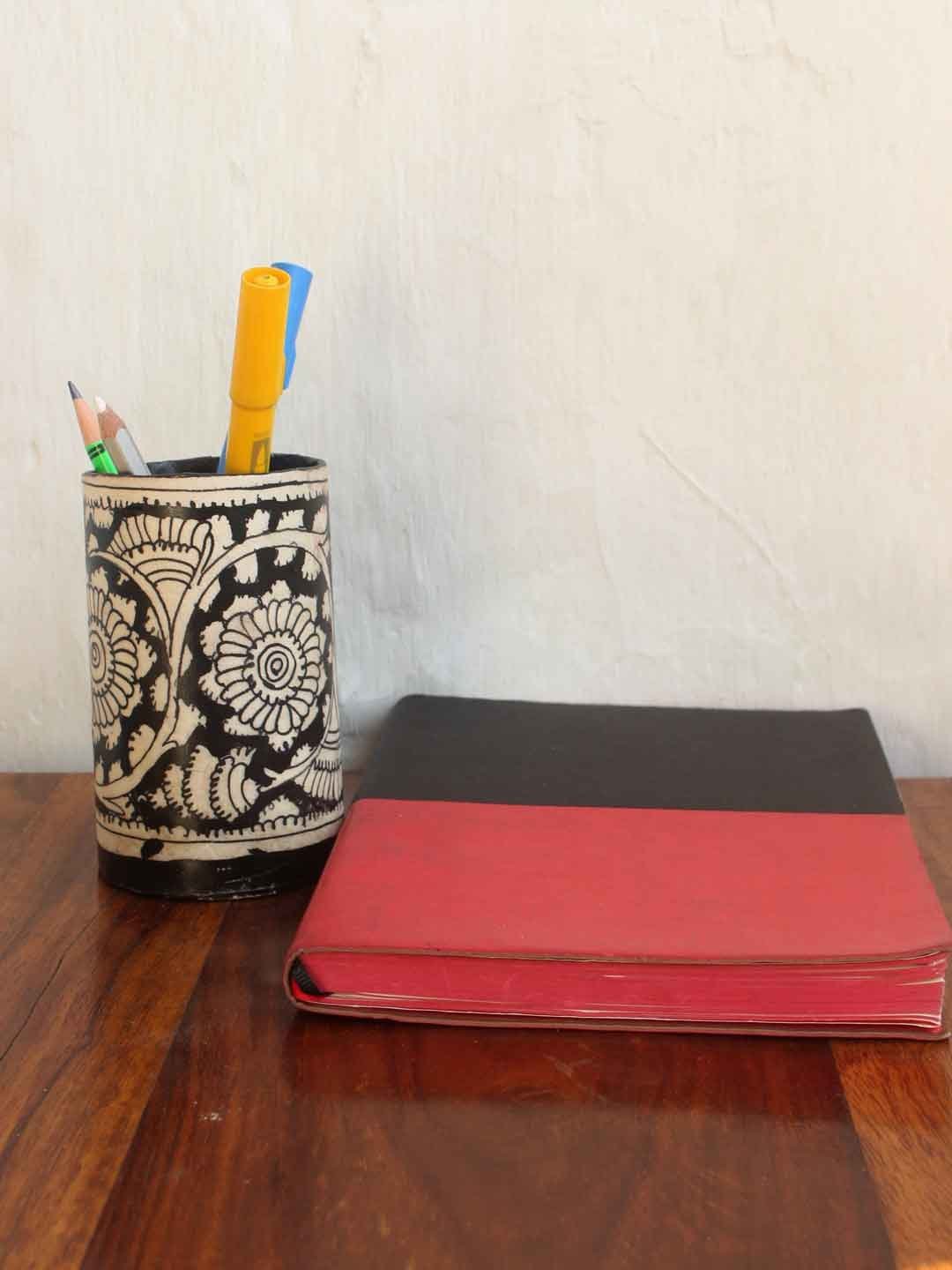Black-white-tholu-bommalata-pen-holder.jpg Black, White Tholu Bommalata Pen holder - Image 1