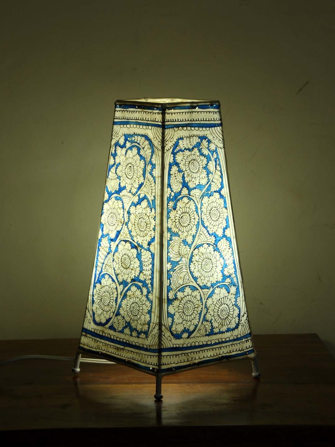 Blue-and-white-Tholu-Bommalata-long-lamp.jpg Blue and White Tholu Bommalata Lamp - Image 1