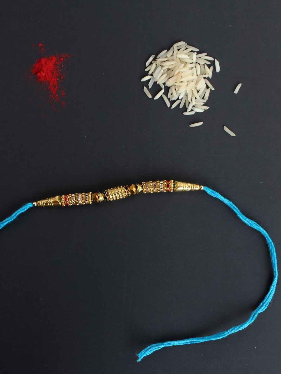 Crystal-work-blue-thread-Rakhi.jpg Crystal-work Blue Thread Rakhi - Image 1