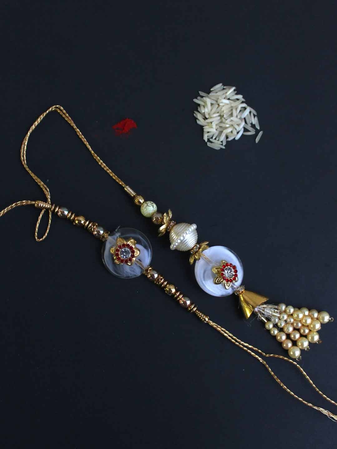 Elegant-Red-and-White-Bhiya-bhabhi-Rakhi.jpg Elegant Red and White Bhaiya-Bhabhi Rakhi - Image 1