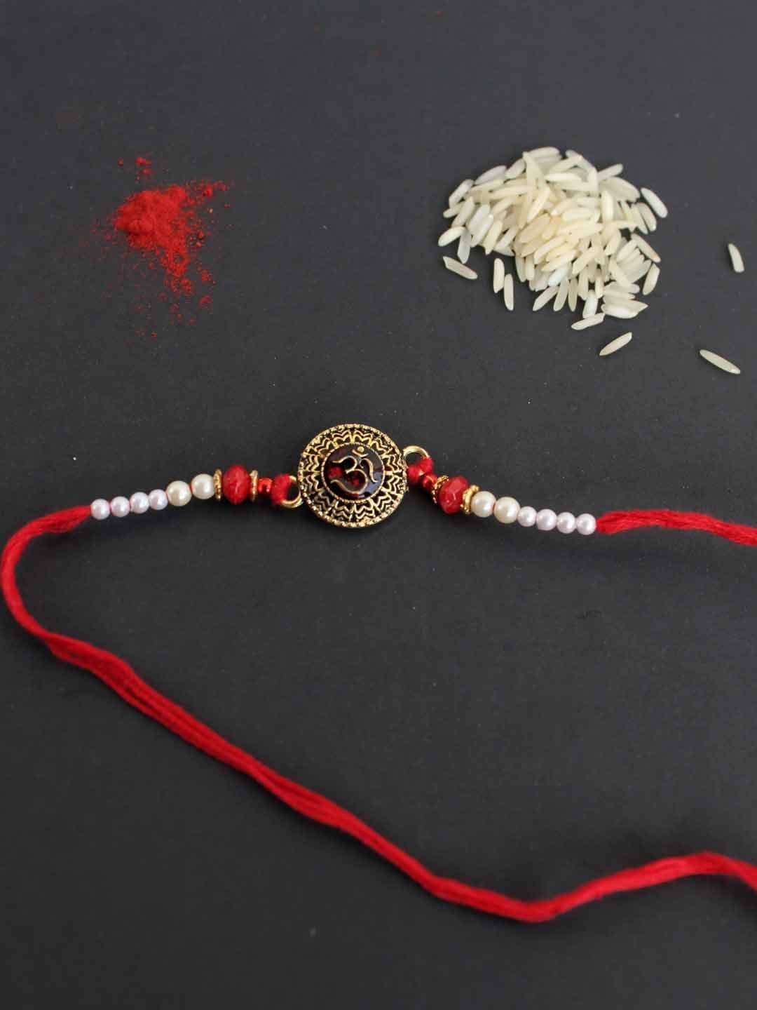 Metallic-Om-Rakhi.jpg Metallic Om Rakhi - Image 1