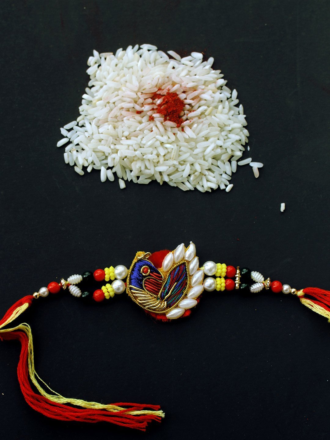 Peacock-zari-work-rakhi.jpg Peacock zardozi rakhi - Image 1