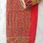 White, blue, yellow phulkari on Red Salwar fabric