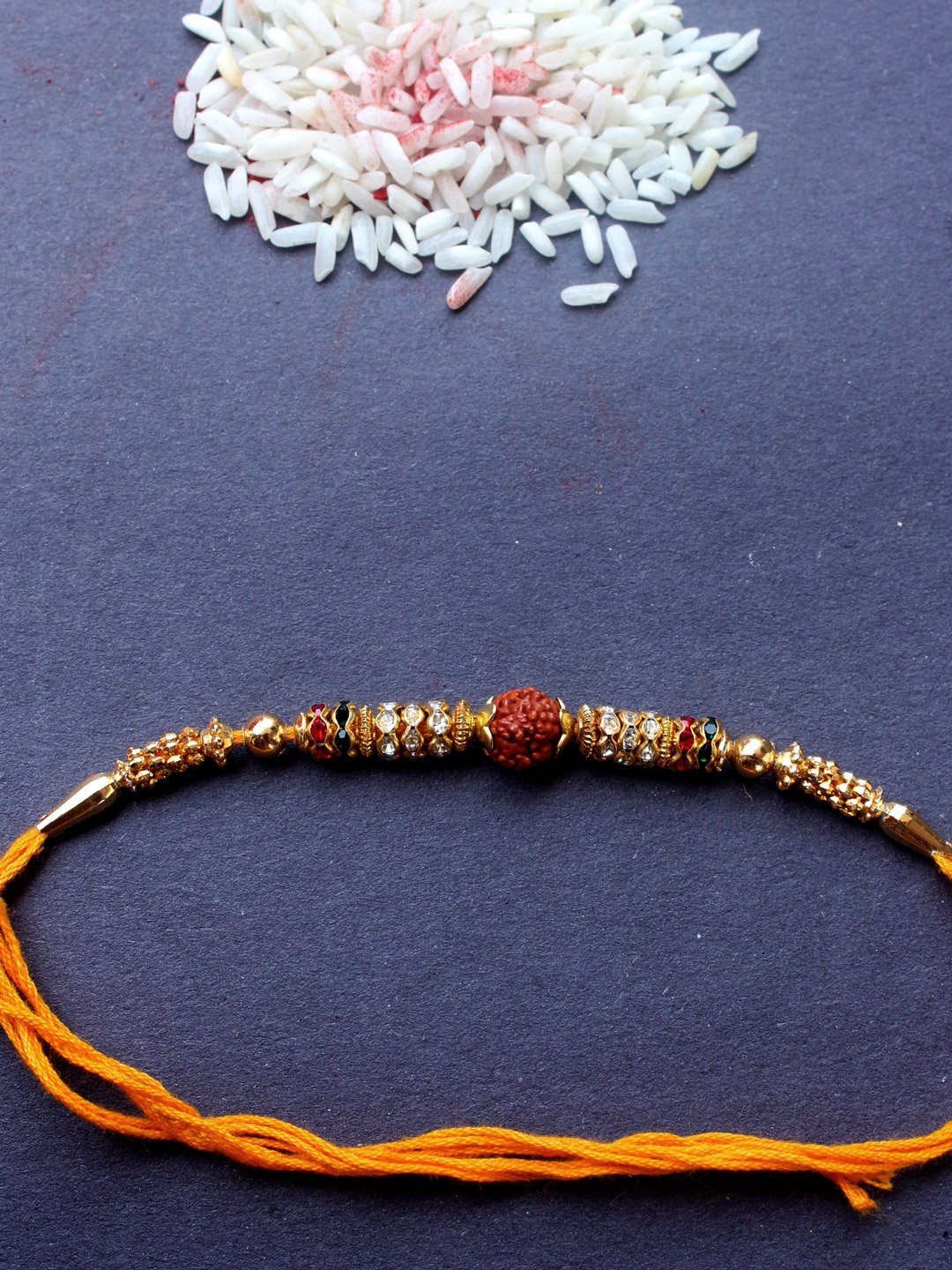 yellow-thread-rudraksha-rakhi.jpg Yellow thread Rudraksha Rakhi - Image 1